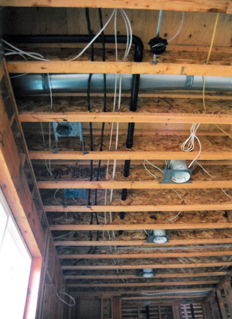 Electrical work in the ceiling for lighting - custom homes by Rick Bernard.